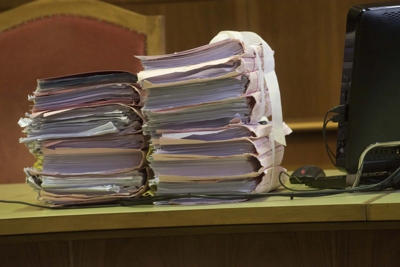 Business records piled on a desk